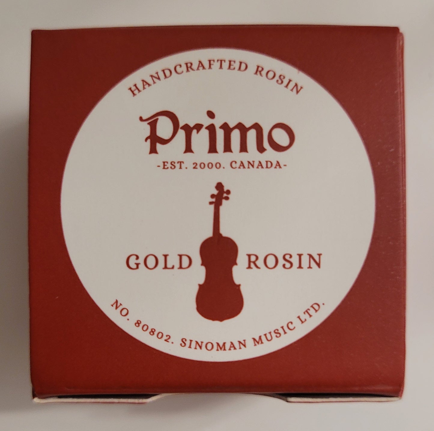 Red box of Primo Gold Rosin with a violin illustration on a white background