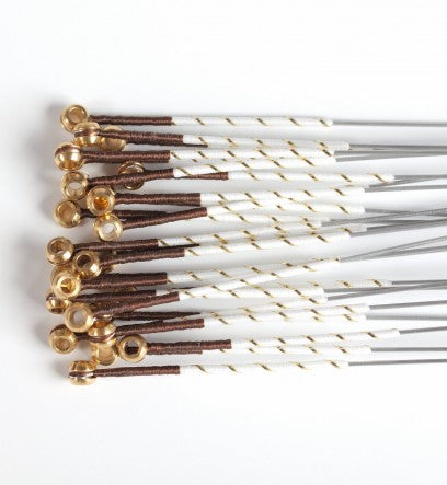 Multiple unwrapped Warchal Amber cello strings for 4/4 size, displayed together in bulk