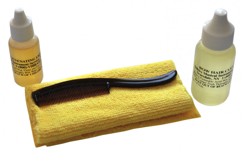 Two small bottles, yellow cloth, and a black comb.