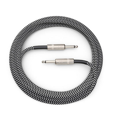 Coiled grey audio cable with metallic connectors on a white background