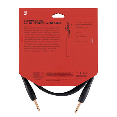 Red packaging of a custom series instrument cable with black cables inside