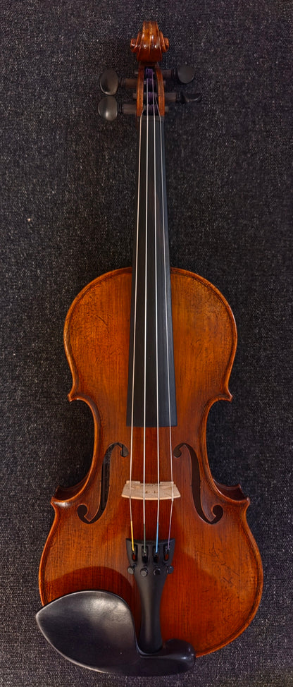 Dark brown violin on a grey background