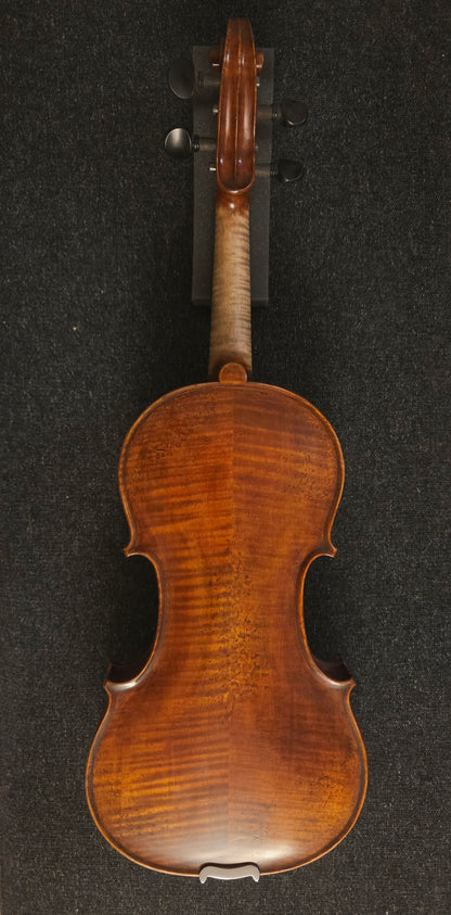 Back of the violin on a grey background